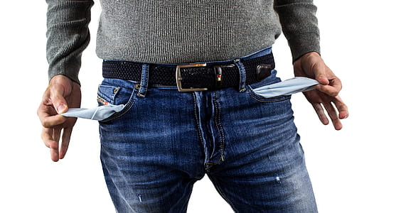 man wearing jeans with empty pockets