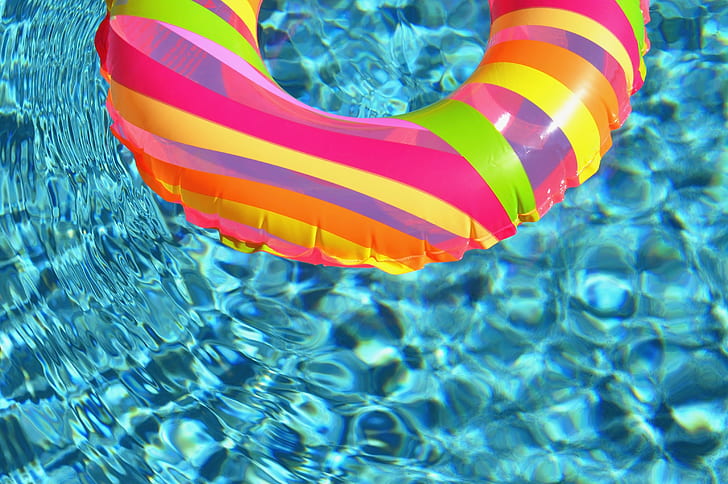 pink inflatable floater on water
