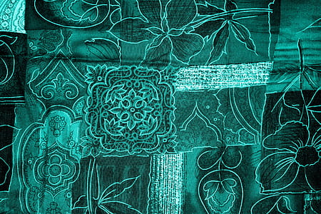 green and white floral textile