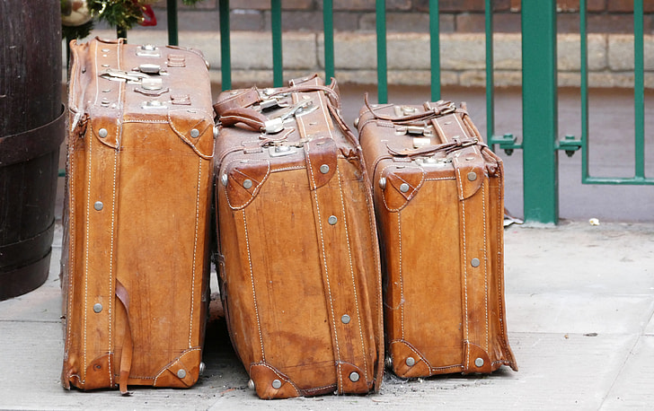 three brown leather luggage set
